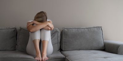 Relaxed Woman Sitting on a Couch